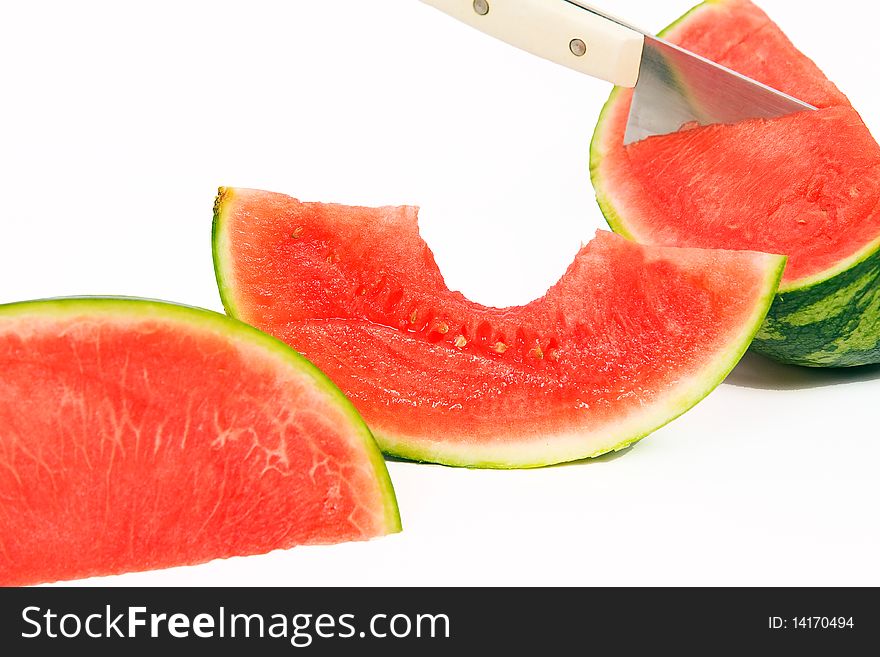 Cut slices of watermelon with knife