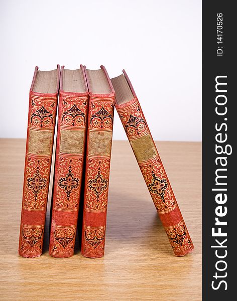 Old books placed on wood desk