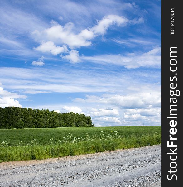 Summer scenery with road, field, forest and clouds. Summer scenery with road, field, forest and clouds.