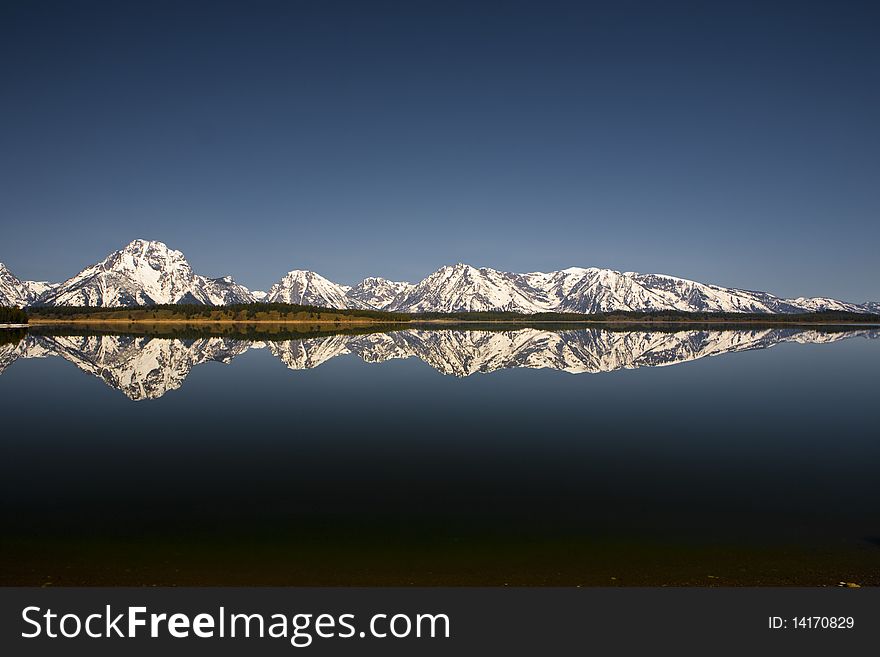 Reflection in the lac of the Grand Tetons in Wyoming