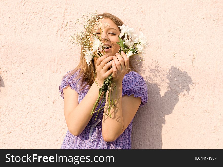 Girl with flowers posing outdoor