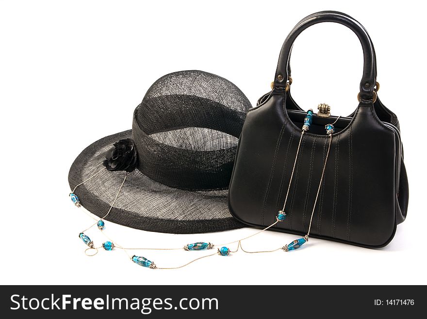 Vintage black starched net, black handbag and necklace from the 1950's isolated against a white studio backgroud. Vintage black starched net, black handbag and necklace from the 1950's isolated against a white studio backgroud