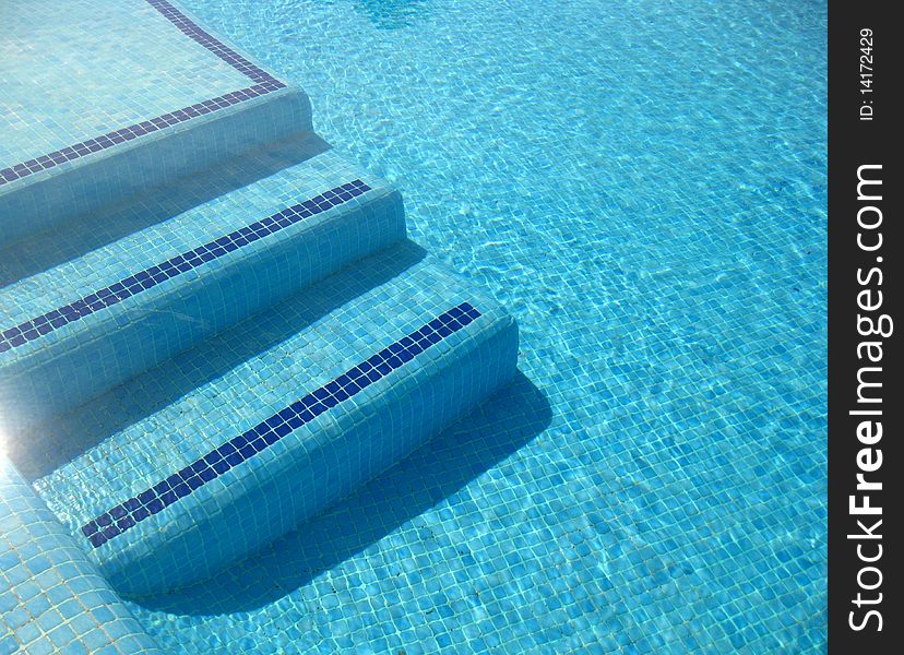 A view on blue clear water in a pool. A view on blue clear water in a pool