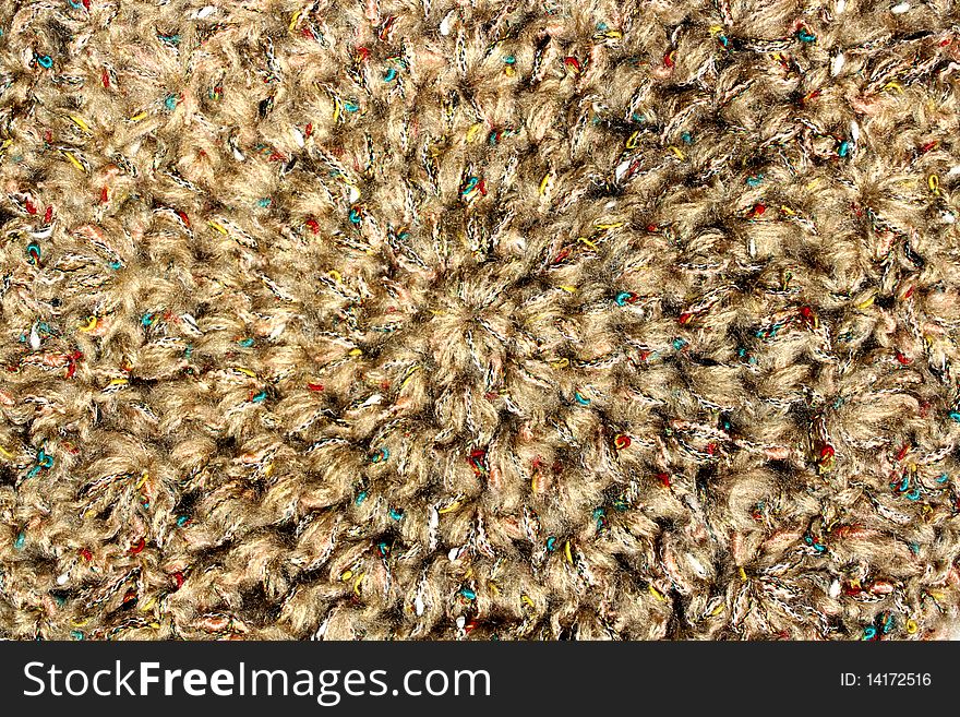 A background of a colorful knitted hat . A background of a colorful knitted hat .