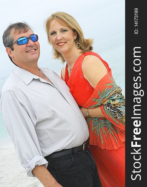 Shot of a gorgeous couple on the beach vertical