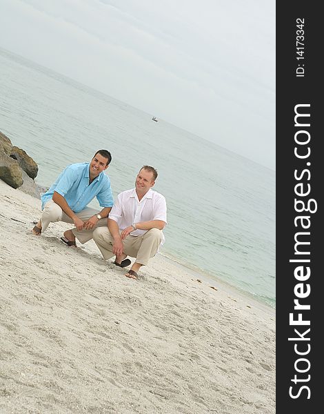 Handsome men on the beach