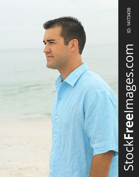 Shot of a male model at the beach side. Shot of a male model at the beach side