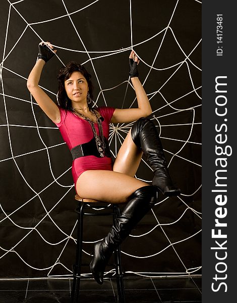 Full length portrait of a sexy woman in spider web