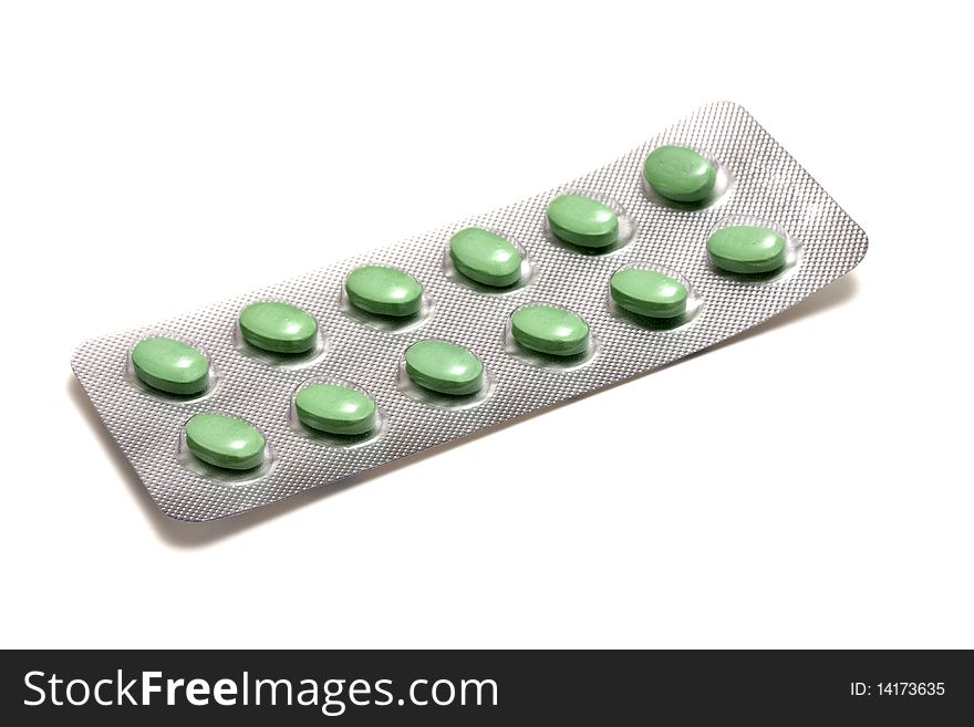 Set of green pills isolated on white background