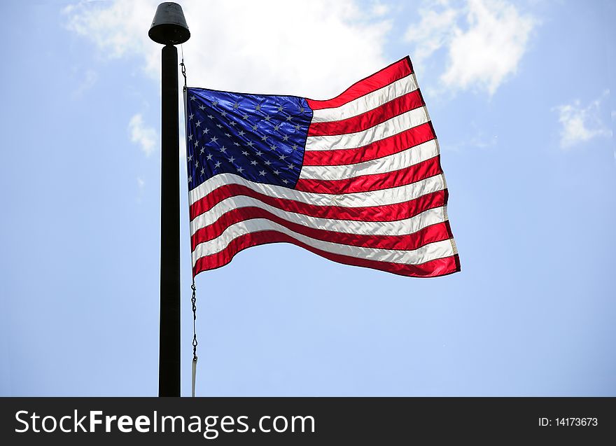 American flag with the blue sky in the background