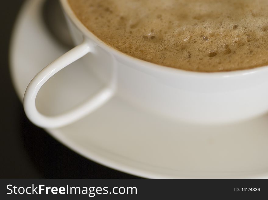 Close up shot of cappuccino cup, shallow depth of field. Close up shot of cappuccino cup, shallow depth of field