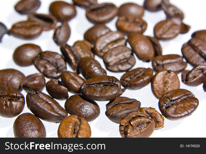 Coffee Grains Over White Background