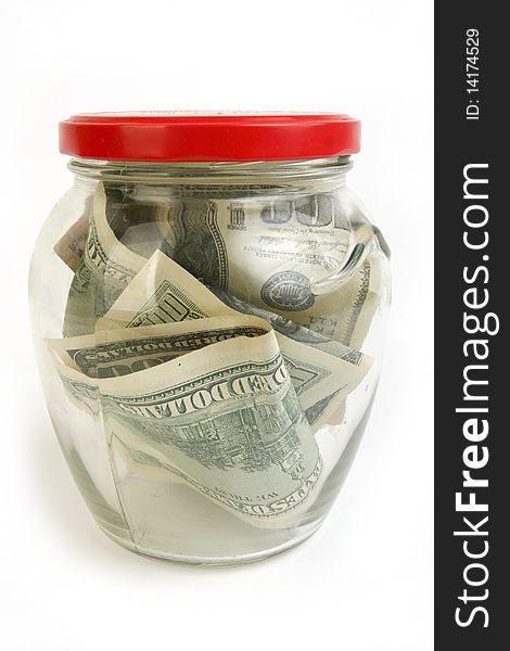 Dollar bills in glass jar on white background. Dollar bills in glass jar on white background