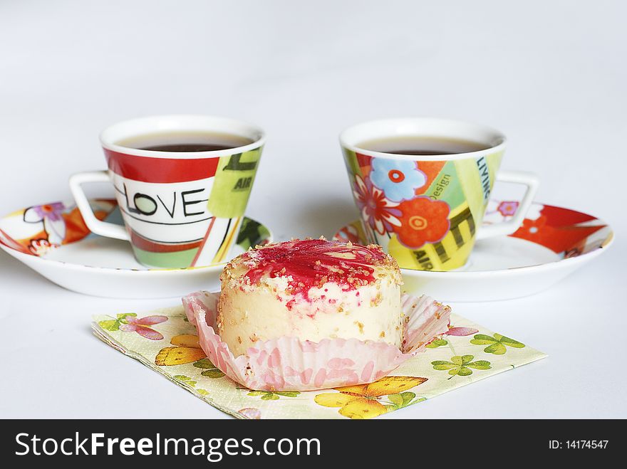 Two coffee cups with sweet cake. Two coffee cups with sweet cake