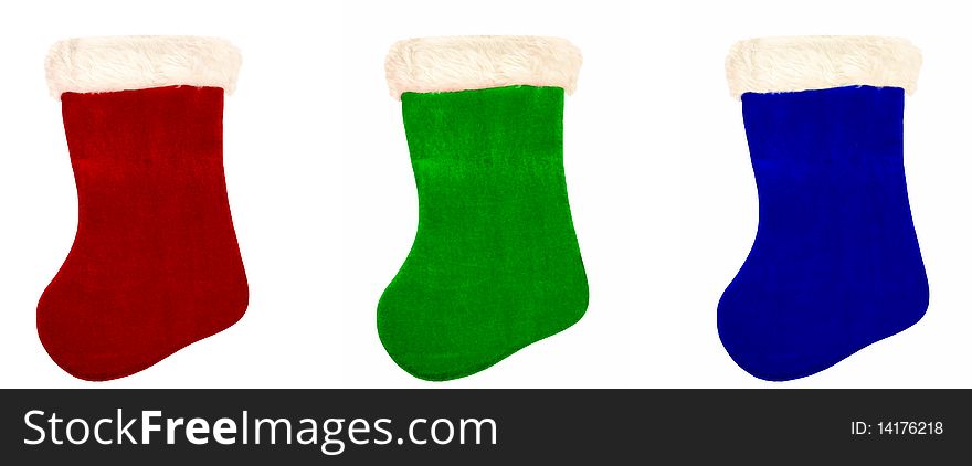 Three Christmas stockings over white.  Red, green, blue. Three Christmas stockings over white.  Red, green, blue.