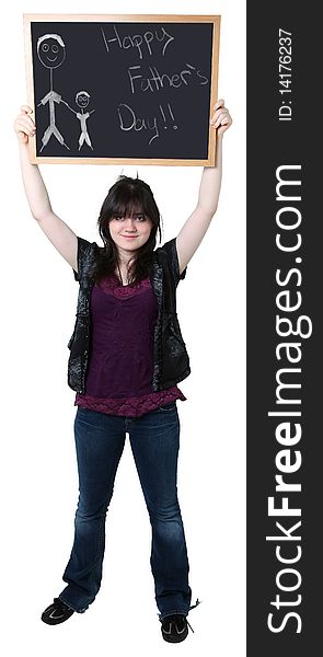 Beautiful sixteen year old teen holding up chalkboard with Happy Father's Day drawing.