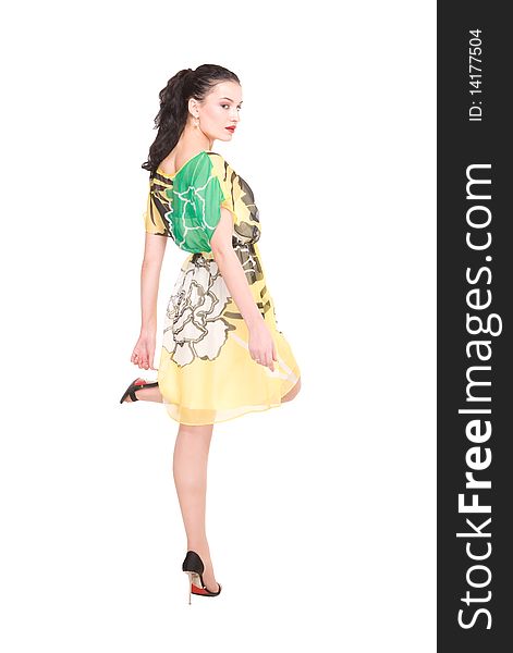 Beautiful young model in modern dress on white with clipping path