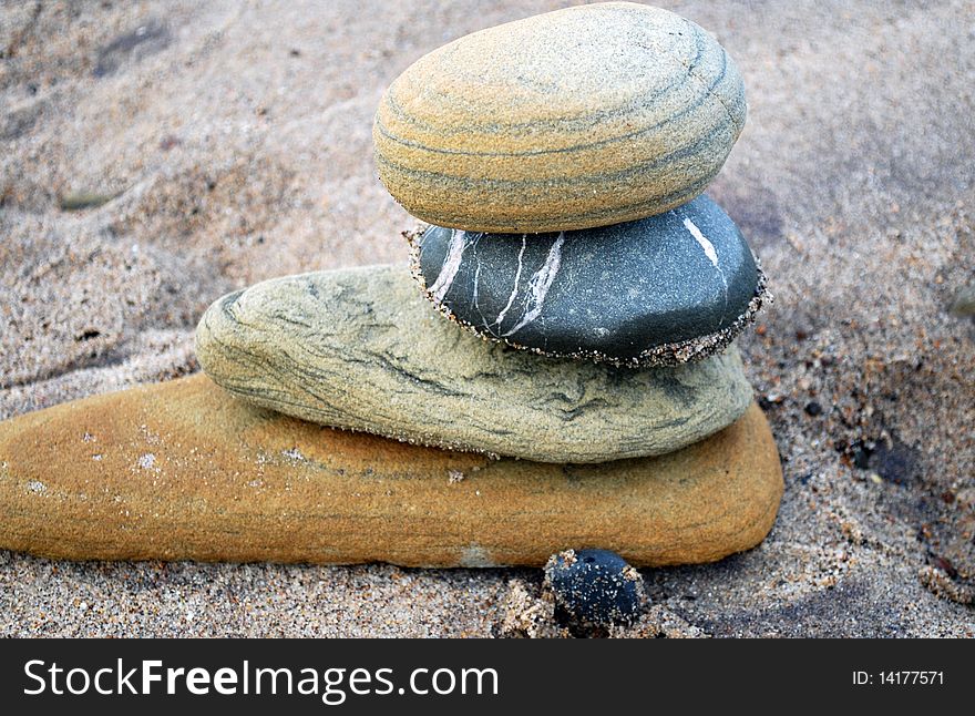 Pile of four stones on the beach. Pile of four stones on the beach