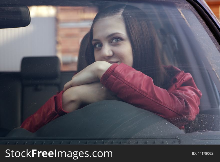 Color photography attractive young woman in automobile