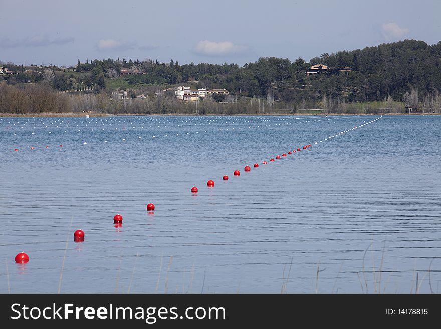 Streets bounded by buoys for canoeing competitions in a lake of Girona. Streets bounded by buoys for canoeing competitions in a lake of Girona