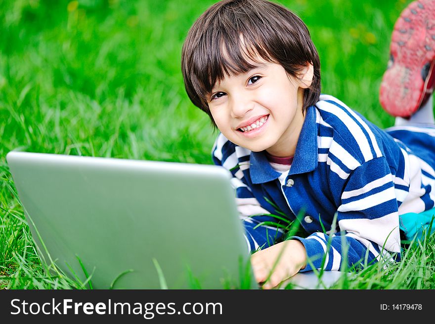Children activity with laptop in nature