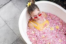 Girl Relaxing In Spa Bath With Flowers Royalty Free Stock Photos