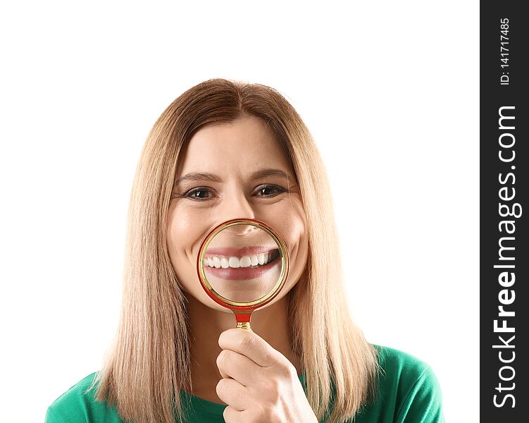 Smiling woman with perfect teeth and magnifier