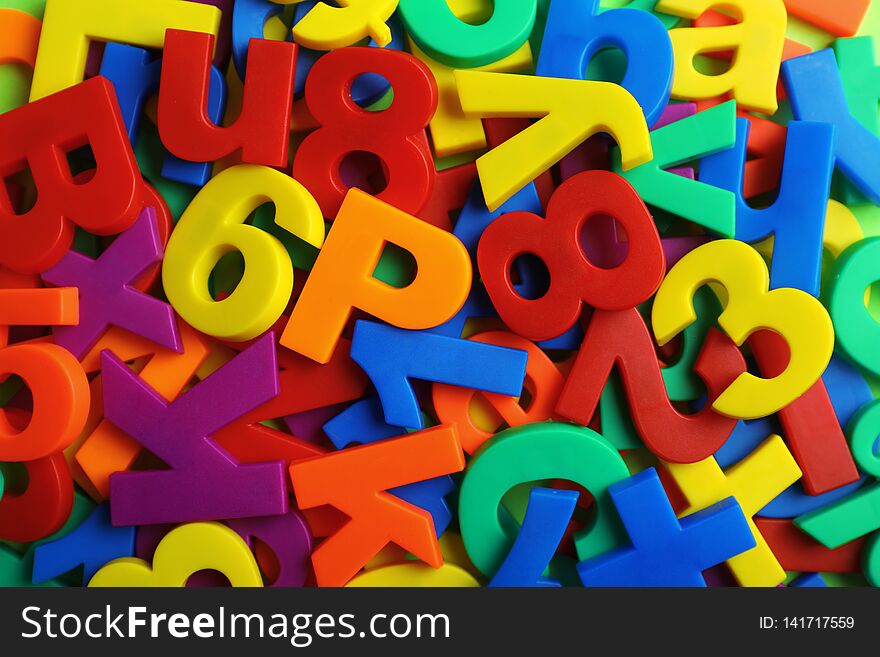 Plastic magnetic letters and numbers as background