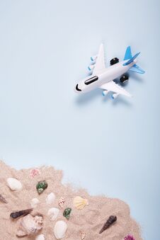 Flat Lay Design Of Travel Concept With Plane On Blue Background With Copy Space. Stock Photo