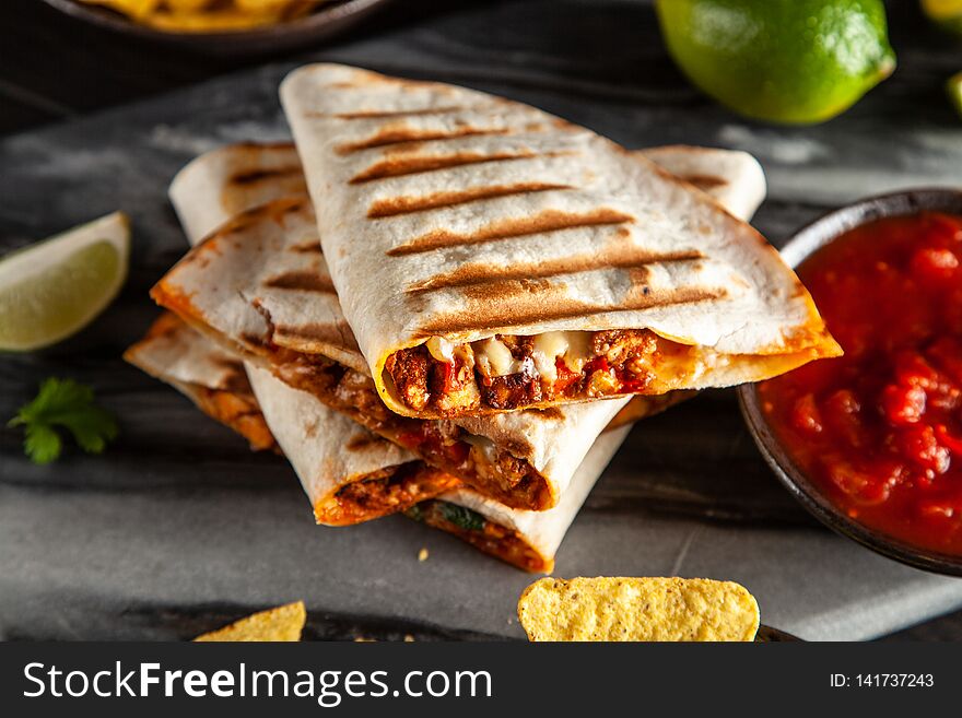 Chicken quesadillas with paprika, cheese and cilantro. Chicken quesadillas with paprika, cheese and cilantro