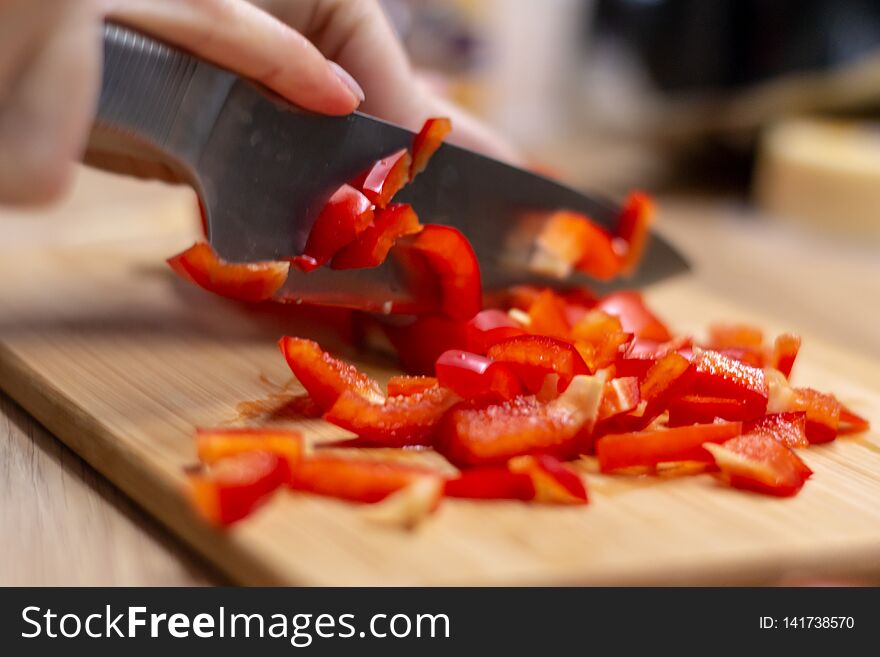 Woman Hands Cutting Vegetables In The Kitchen