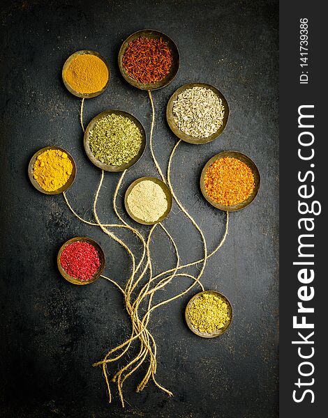 Food art creative concepts. Various bowls of spices over dark background - flat lay