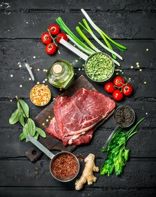 Healthy Food. Raw Beef Steaks With Organic Vegetables And Spices Royalty Free Stock Photos