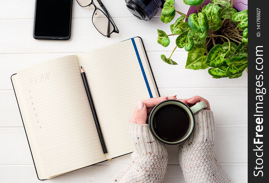 Top View Of Girl Holding Coffee Mug At Working Place