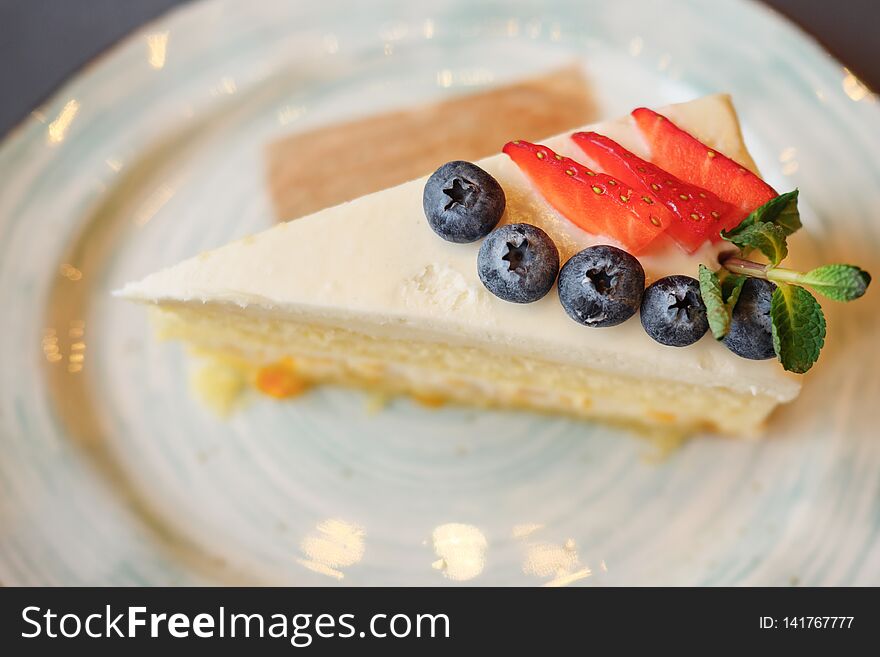 A Piece Cake With Strawberry And Blueberry On Plate