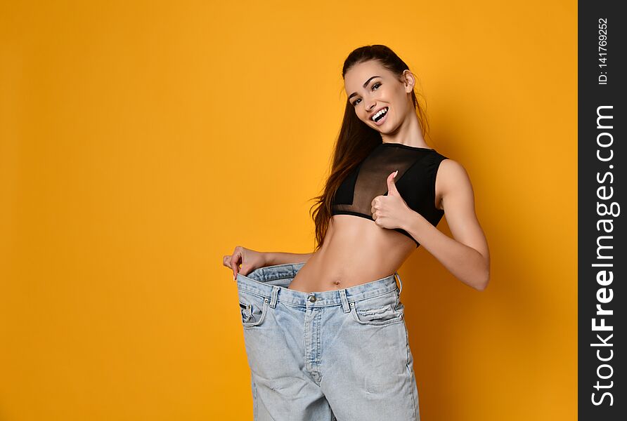 Beautiful Young Woman With Big Jeans