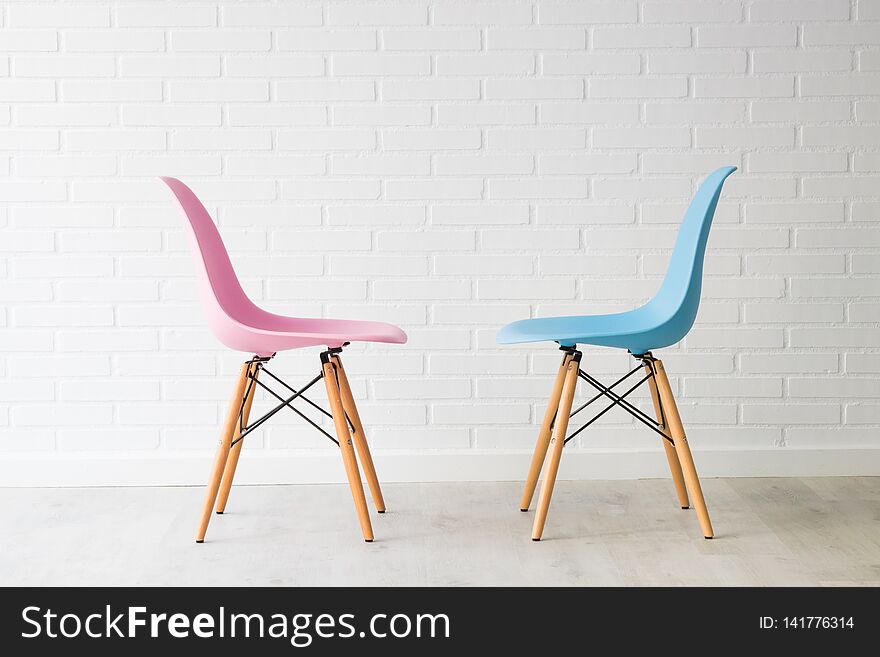 Pair of chairs in pink and blue