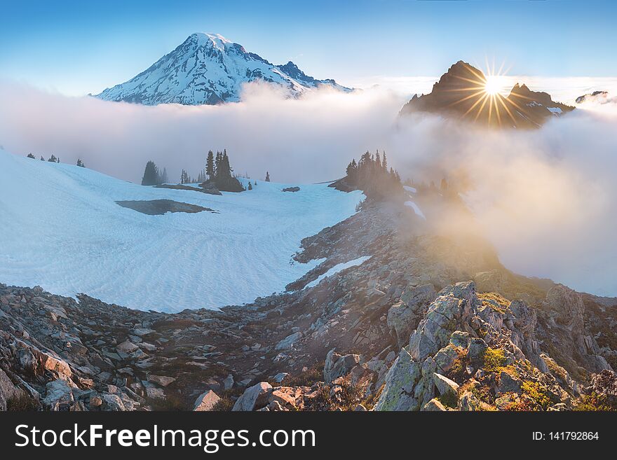 Morning Light High Above The Cloud Layer On Mount Rainier. Beautiful Paradise Area, Washington State, USA.