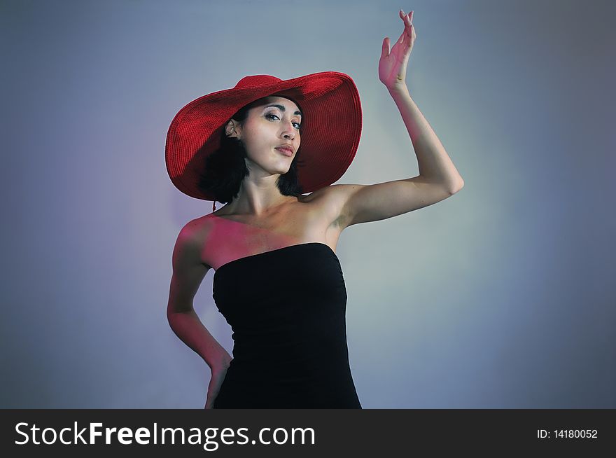 Portrait of young elegant woman wearing black dress and hat. Portrait of young elegant woman wearing black dress and hat