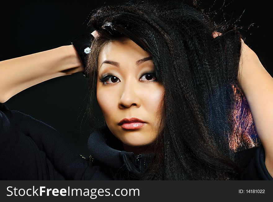Portrait of beauty brunette asian girl on black background. Portrait of beauty brunette asian girl on black background