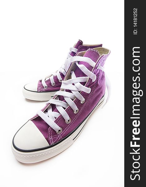 Brand new purple sneakers on white background