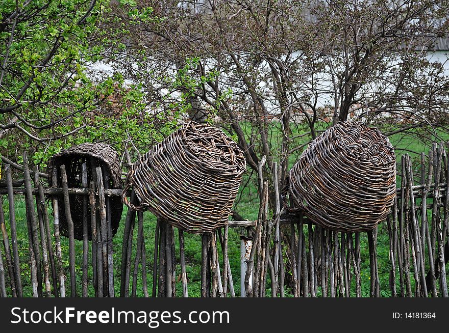 Wicker Baskets On Wicker Fence