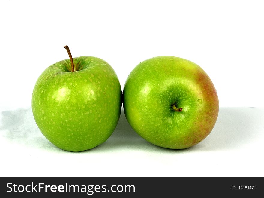 Green apples on white background.
