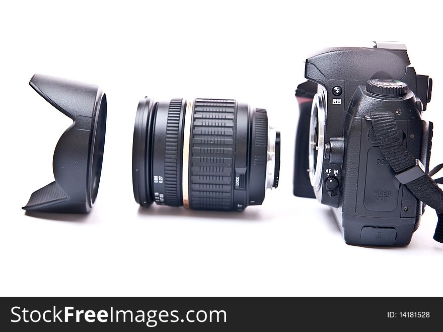 Modern digital camera equipped with zoom lens isolated on white