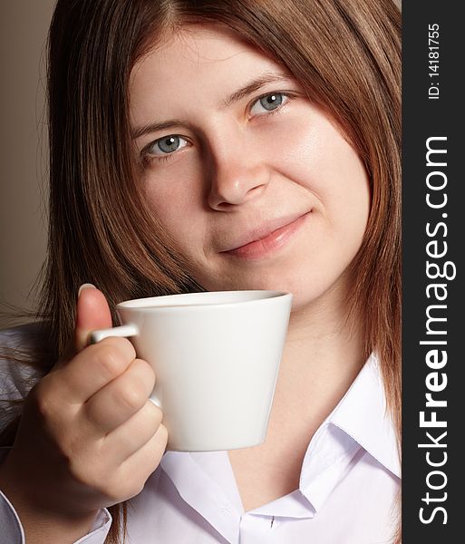 Shot of young girl with coffee