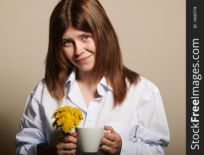 Girl with coffee. studio shot