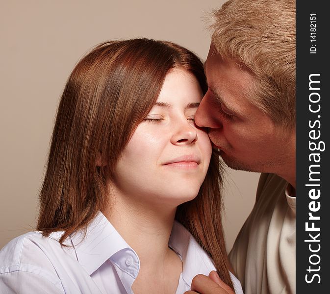 Couple: young man kissing girl