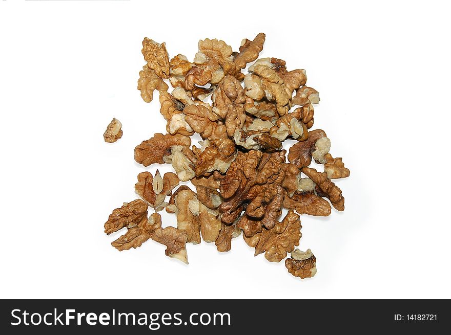 A handful of walnuts with a light shade on white background