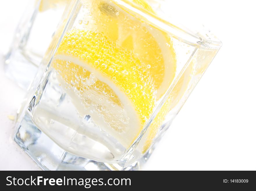 Two glasses with soda water and lemon slices