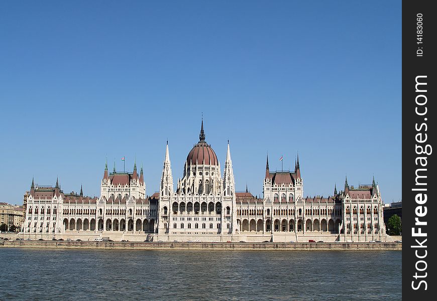 The neogothic palace of the Hungarian Parliament in Budapest at the River Danube. The neogothic palace of the Hungarian Parliament in Budapest at the River Danube.